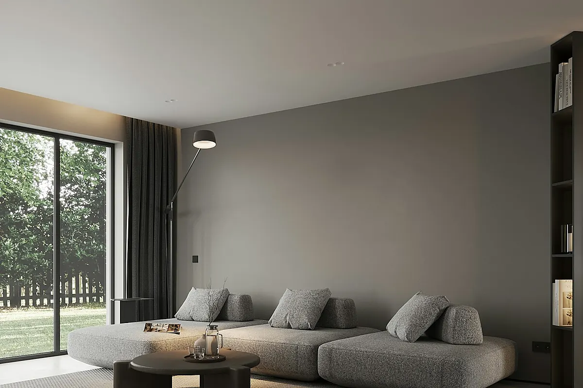 Light-toned lounge with sofa and round wall mirrors, styling reference for a terrace home interior